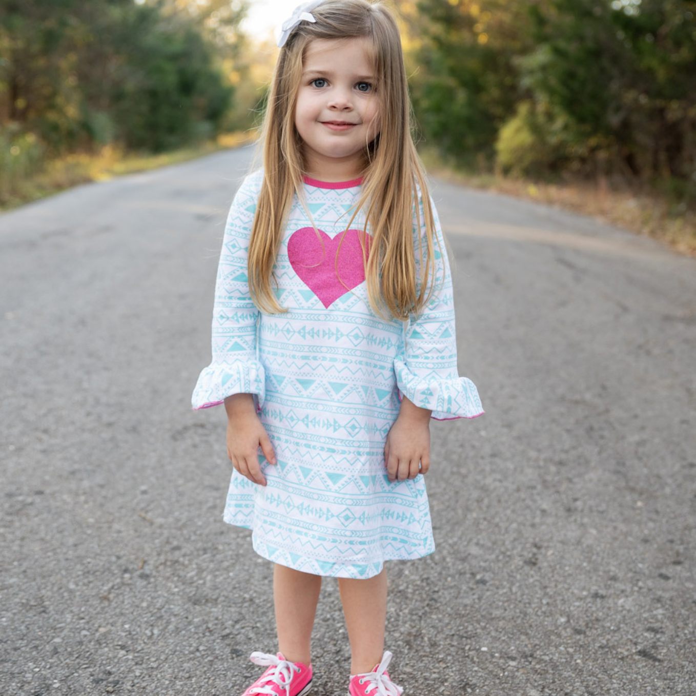 AL Limited Girls Boutique dress featuring blue and pink heart design, soft cotton fabric, and ruffled sleeves, perfect for young girls.